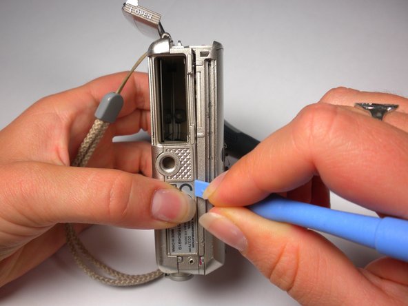 Olympus Stylus 410 Battery Cover Replacement: step 9, image 1 of 3