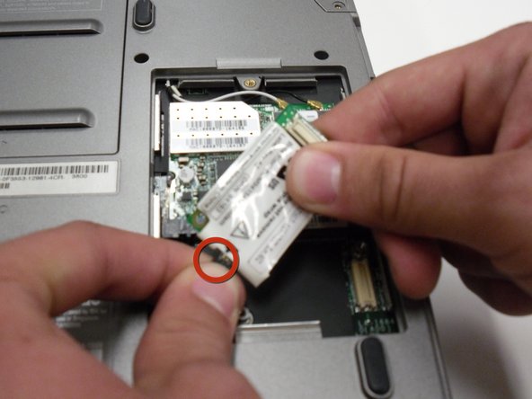 Removing the Dell Inspiron 1150 Modem Card: step 4, image 2 of 2