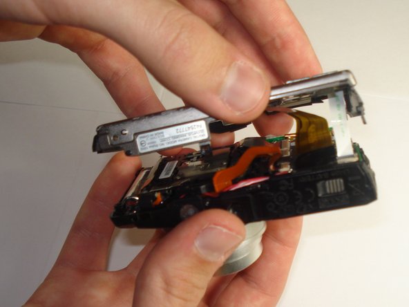 Disassembling Olympus Stylus 1010 Case: step 7, image 1 of 3