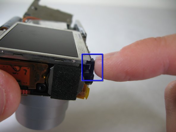 Disassembling Pentax Optio S4i Lens Assembly: step 15, image 1 of 2