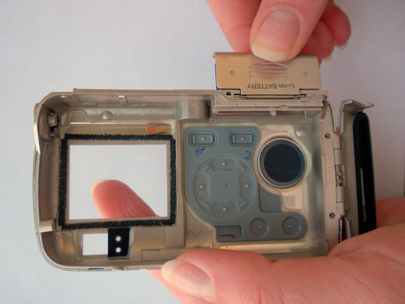 Olympus Stylus 410 Battery Cover Replacement: step 12, image 1 of 2