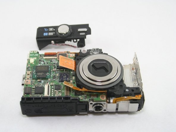 Canon PowerShot SD1100 IS Top Button Assembly Replacement: step 8, image 1 of 1