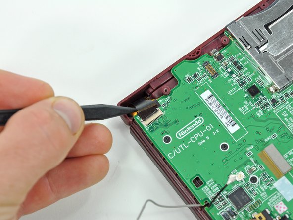 Nintendo DSi XL Front Bezel Replacement: step 11, image 2 of 2