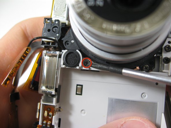 Disassembling Pentax Optio S4i Lens Assembly: step 26, image 1 of 3