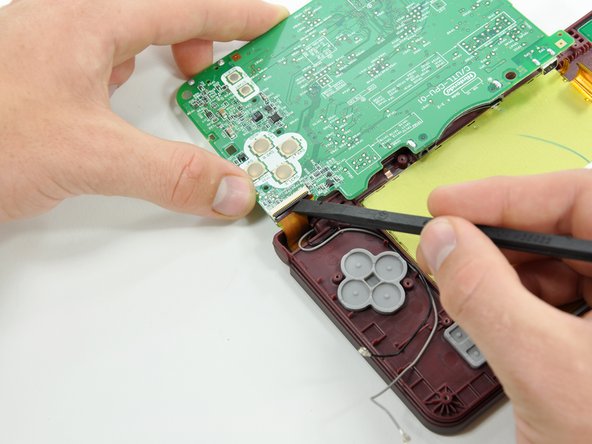 Nintendo DSi XL Camera Ribbon Replacement: step 20, image 1 of 2