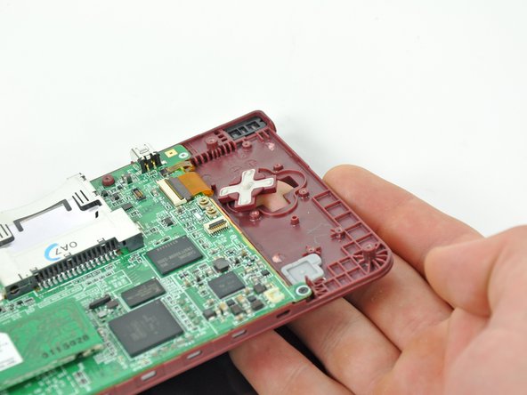 Nintendo DSi XL D-pad Replacement: step 12, image 1 of 2