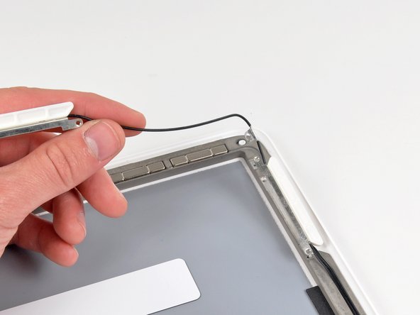 MacBook Unibody Model A1342 Rear Display Bezel Replacement: step 34, image 1 of 2