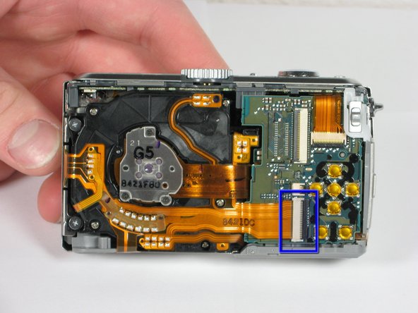 Panasonic Lumix DMC-TZ5 Button Board Replacement: step 8, image 1 of 2