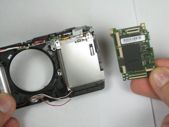 Disassembling Olympus Stylus 1010 Logic Board: step 14, image 2 of 2