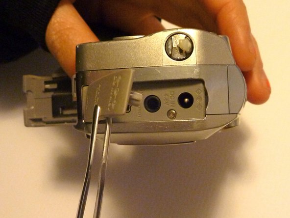 Olympus D590 Retainer Clip Replacement: step 4, image 1 of 1