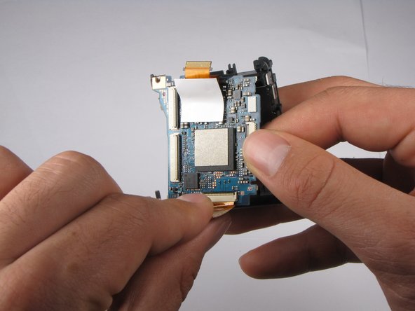 Repairing Sony Cyber-shot DSC-W290 Motherboard: step 23, image 1 of 3