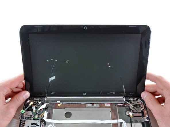 HP Mini 1000 Left Display Hinge Replacement: step 33, image 1 of 2
