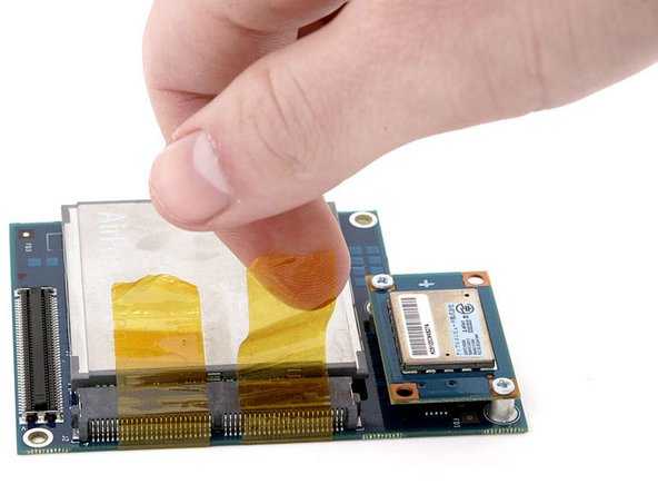 Mac mini (PowerPC) Wireless Interface Board Replacement: step 14, image 1 of 1