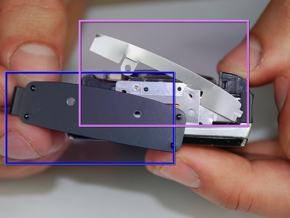 Canon PowerShot SD870 IS Card and Battery Slot Replacement: step 5, image 2 of 2