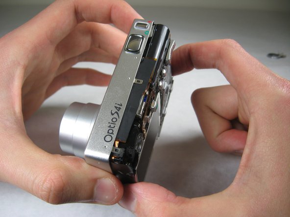 Disassembling Pentax Optio S4i Lens Assembly: step 5, image 1 of 2