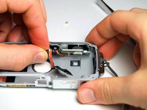 Pentax Optio WP Shutter and Power Buttons Replacement: step 9, image 2 of 3