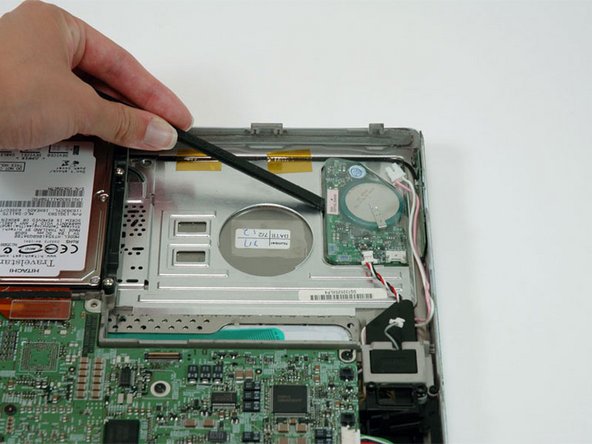 PowerBook G4 Titanium DVI PRAM Battery Replacement: step 7, image 1 of 1