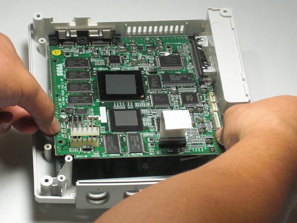 Sega Dreamcast Logic Board Removal: step 22, image 1 of 2