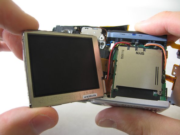 Disassembling Pentax Optio S4i Lens Assembly: step 17, image 2 of 3