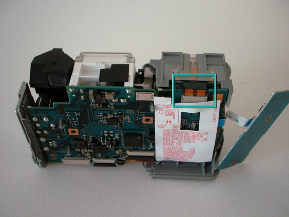 Sony Cyber-shot DSC-W5 Lens Replacement: step 13, image 1 of 2