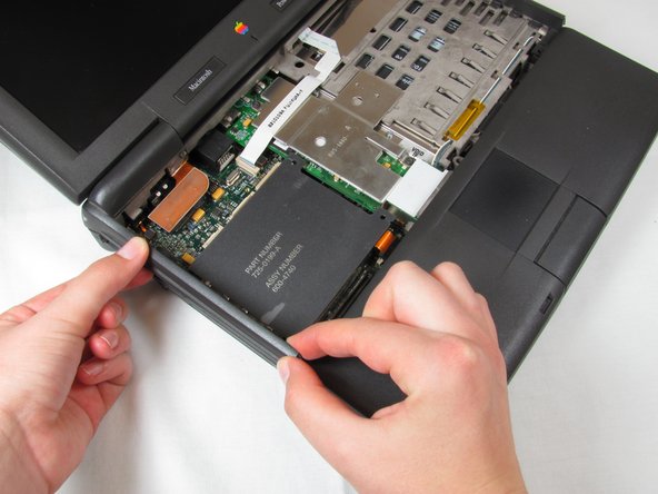 PowerBook 3400 M3553 Track Pad Panel Replacement: step 7, image 1 of 1