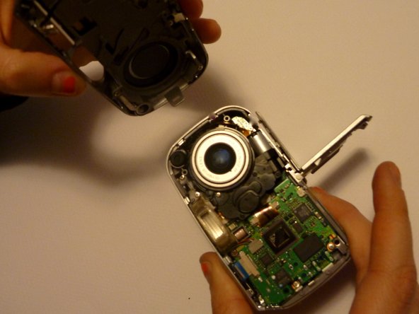 Olympus D590 Retainer Clip Replacement: step 7, image 1 of 1