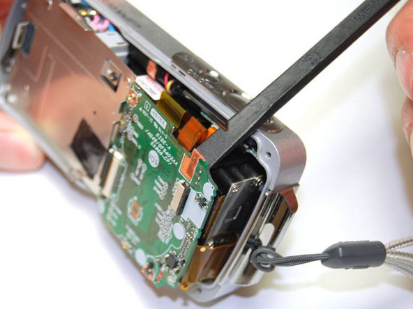 Pentax Optio WP Shutter and Power Buttons Replacement: step 7, image 1 of 3