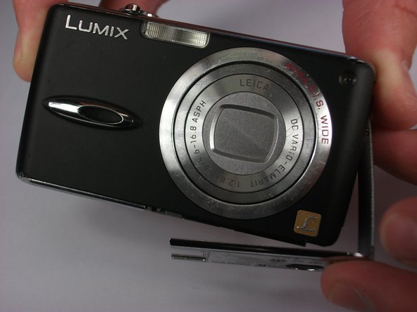 Panasonic Lumix DMC-FX01 On/ Off and Settings Button cover replacement: step 6, image 2 of 2