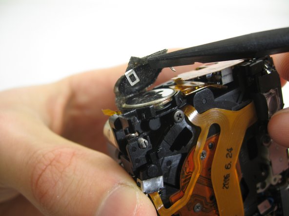 Disassembling Pentax Optio S4i Lens Assembly: step 19, image 2 of 3