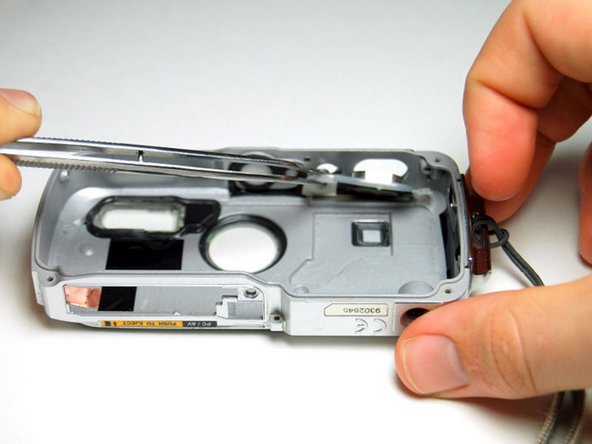 Pentax Optio WP Shutter and Power Buttons Replacement: step 9, image 3 of 3