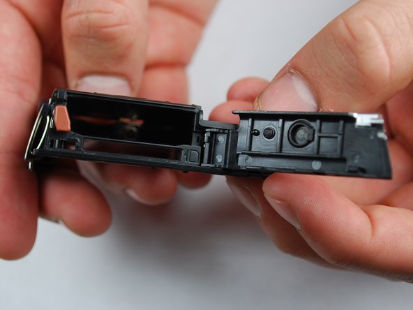 Canon PowerShot SD870 IS Card and Battery Slot Replacement: step 20, image 1 of 1