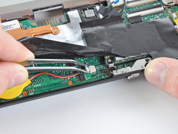 HP Mini 1000 PRAM Battery Replacement: step 19, image 1 of 2