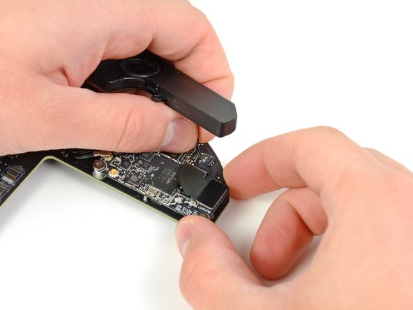 Mac Mini Mid 2011 Speaker Replacement: step 19, image 1 of 2