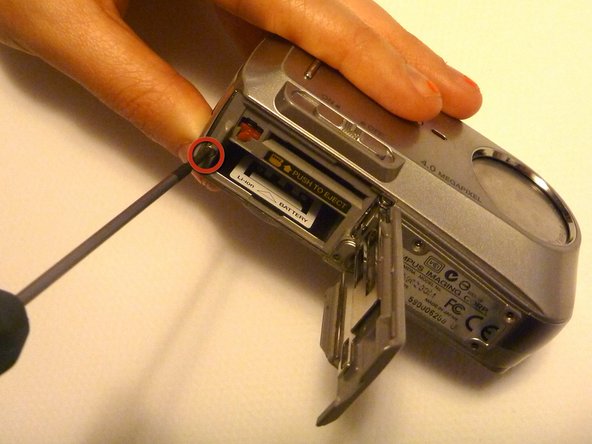 Olympus D590 Retainer Clip Replacement: step 3, image 1 of 1