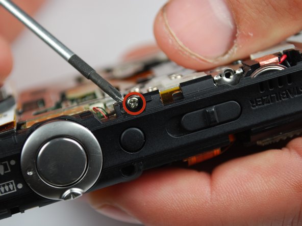 Canon PowerShot SD870 IS Card and Battery Slot Replacement: step 13, image 2 of 2