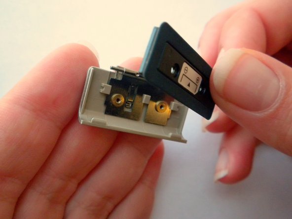 Olympus Stylus 410 Battery Cover Replacement: step 13, image 3 of 3