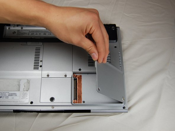 HP Pavilion dv1000 Back Cover Replacement: step 6, image 3 of 3