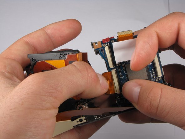 Repairing Sony Cyber-shot DSC-W290 Motherboard: step 19, image 2 of 3