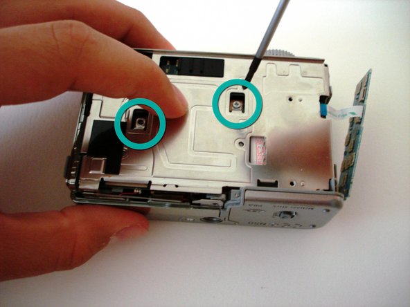 Sony Cyber-shot DSC-W5 battery compartment replacement: step 8, image 1 of 2