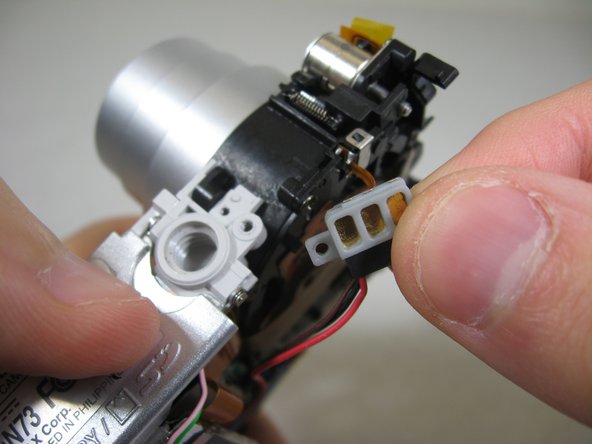 Disassembling Pentax Optio S4i Lens Assembly: step 27, image 2 of 2