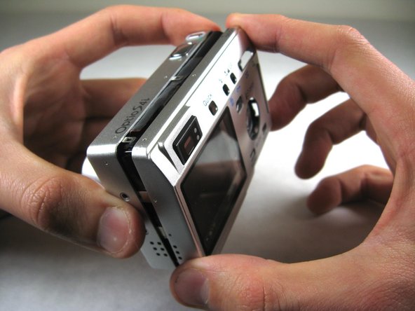 Disassembling Pentax Optio S4i Lens Assembly: step 3, image 1 of 2