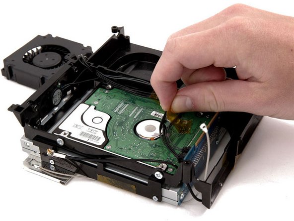 Mac mini (PowerPC) Speaker Replacement: step 12, image 1 of 1