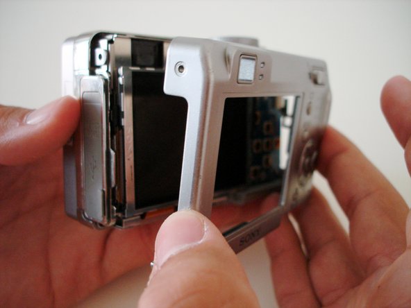 Disassembling Sony Cyber-shot DSC-W5 Back Cover: step 3, image 1 of 2