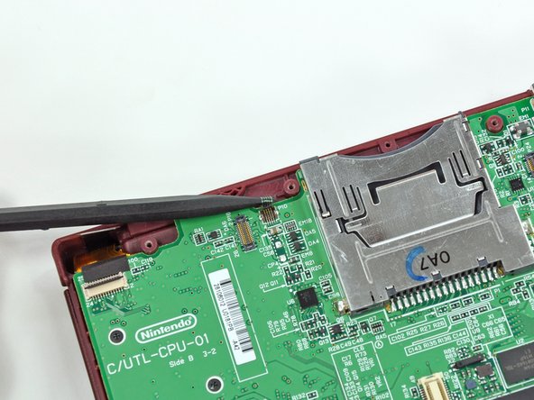 Nintendo DSi XL Front Bezel Replacement: step 12, image 2 of 2