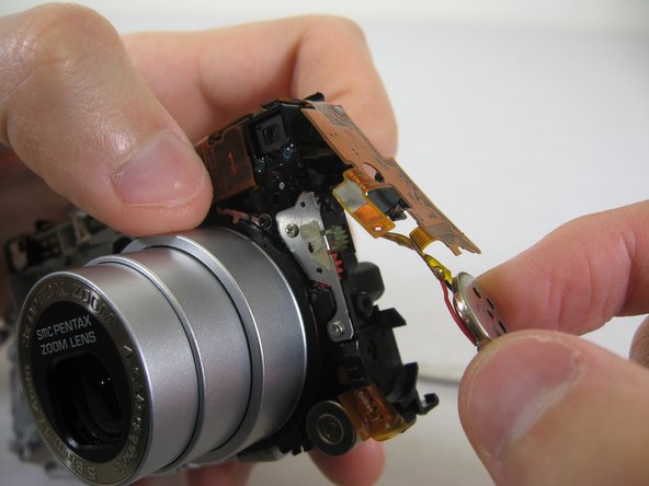 Disassembling Pentax Optio S4i Lens Assembly: step 21, image 2 of 2