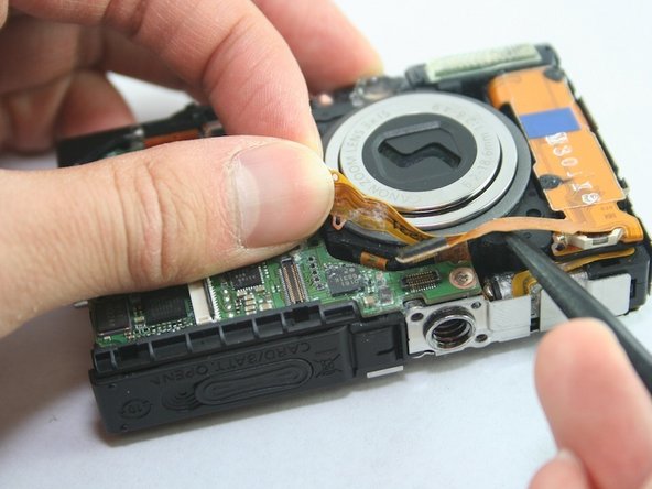 Disassembling Canon PowerShot SD1100 IS AV port and Logic board: step 13, image 1 of 2