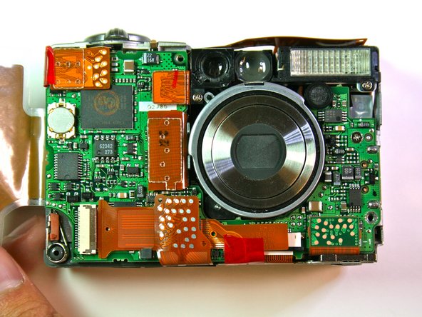 Canon Powershot S200 Camera lens Replacement: step 15, image 1 of 2