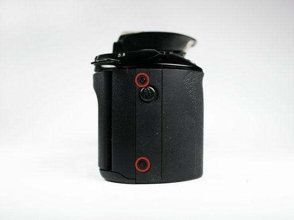 Disassembling Canon EOS Rebel XS Battery Door: step 5, image 1 of 1