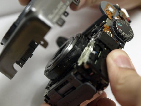 Disassembling Canon PowerShot A590 IS Front Cover, Remove Front Cover: step 9, image 1 of 2