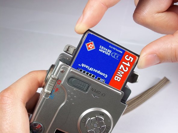 Canon PowerShot S230 Memory Card Replacement: step 3, image 1 of 2